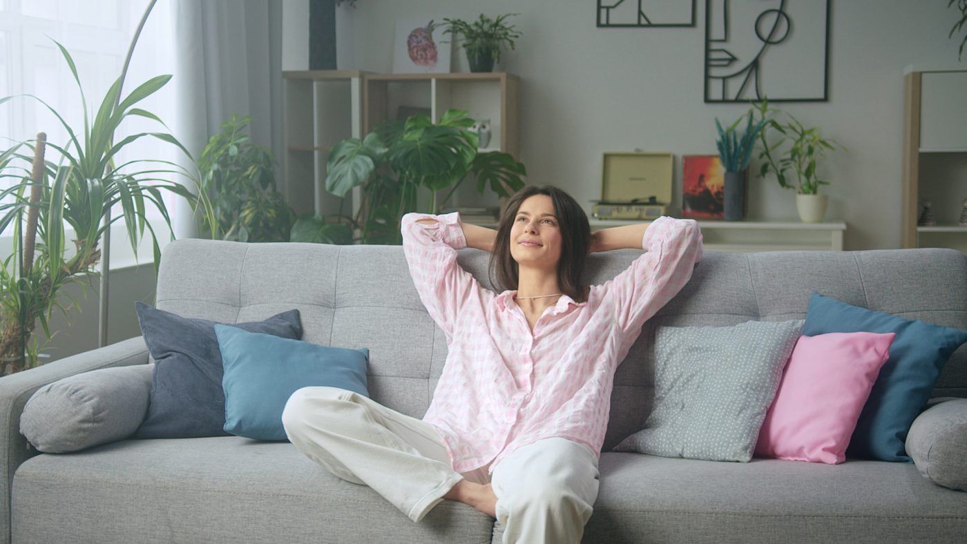 Woman-on-couch-breathing-clean-fresh-air